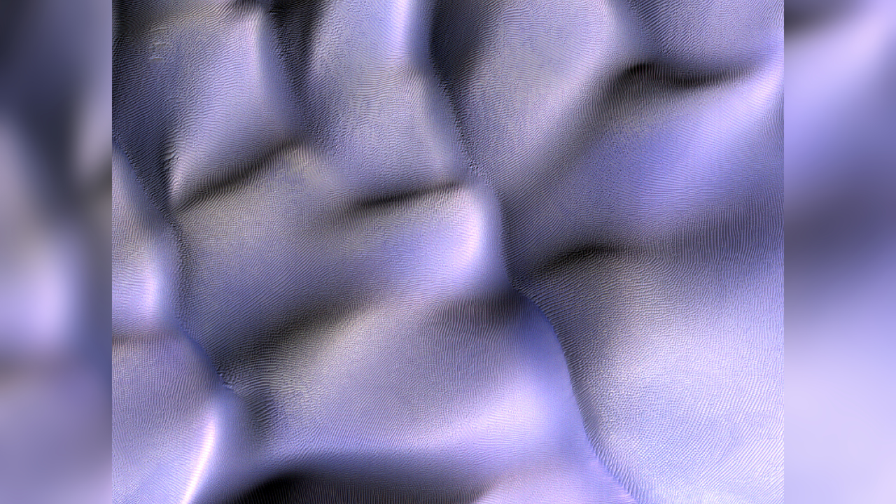 Wavy alien dune fields stretch...